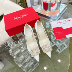 EFFLORESCENCE POINTED-TOE PUMPS IN WHITE SATIN WITH CRYSTAL BUCKLE
