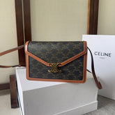 CELINE 25S WALLET MARGO 22MM IN BLACK TRIOMPHE CANVAS AND BROWN CALFSKIN