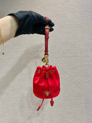 MINI BUCKET BAG 10 IN RED RE-NYLON AND SAFFIANO LEATHER STRAP
