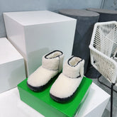 MINI ANKLE BOOT IN WHITE SHEARLING WITH BLACK ULTRA LIGHTWEIGHT RUBBER OUTSOLE