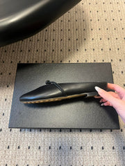 BOTTEGA VENETA 26S FLAT MULES IN BLACK LAMBSKIN