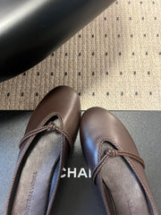 BOTTEGA VENETA 26S FLAT MULES IN DARK BROWN LAMBSKIN