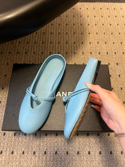 BOTTEGA VENETA 26S FLAT MULES IN BLUE LAMBSKIN