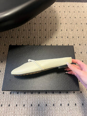 BOTTEGA VENETA 26S FLAT MULES IN CREAM WHITE LAMBSKIN