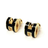 CLASSIC BLACK H ENAMEL OVAL STUD EARRINGS