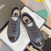 CHANEL 25S SNEAKERS WITH PATENT TOE 20MM IN BLACK CALFSKIN