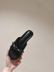 CAGOLE FLAT SANDALS IN BLACK WAX-OIL SHEEPSKIN