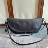 CELINE 25S HALFMOON SOFT TRIOMPHE BAG 46MM IN BLACK SUPPLE SHINY LAMBSKIN