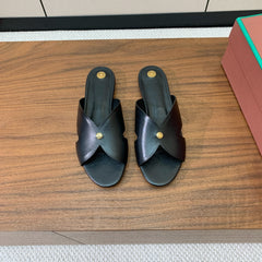 FLAT SLIPPERS IN BLACK CALFSKIN