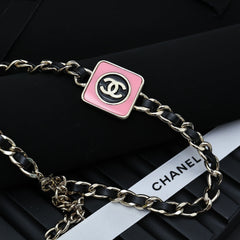 CHAIN CHOKER IN GOLD-PLATED METAL WITH LEATHER THROUGH LINKS