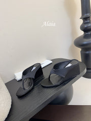ALAIA WEDGE THONG SANDALS 25S IN BLACK SATIN