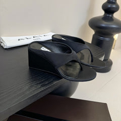 ALAIA WEDGE THONG SANDALS 25S IN BLACK SATIN