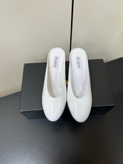 ALAIA WEDGE MULES 25S IN CREAM WHITE LAMBSKIN