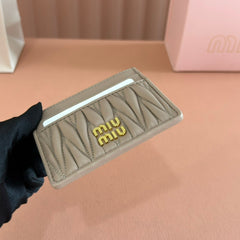 MM MATELASSÉ CARD HOLDER 10.5 IN BEIGE CALFSKIN