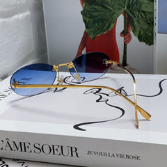 FIRST CRYSTAL RIMLESS OVAL FRAME SUNGLASSES 557152 IN METAL