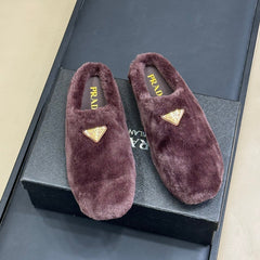 PRADA 25S CLOGS IN WINE RED SHEARLING