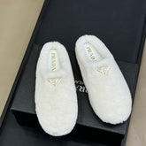 PRADA 25S CLOGS IN WHITE SHEARLING