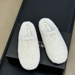 PRADA 25S CLOGS IN WHITE SHEARLING