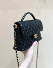 QUILTED FLAP BAG WITH HANDLE 26 IN BLACK LAMBSKIN GOLD PLATED METAL