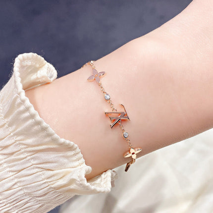 STAR AND SUN 7 MOTIFS GOLD BRACELET