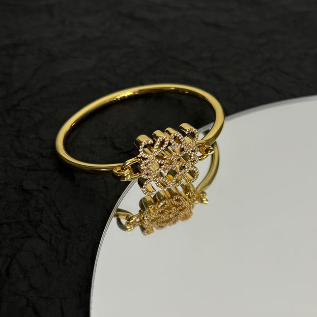 PAVED ANAGRAM OPEN GOLD BRACELET