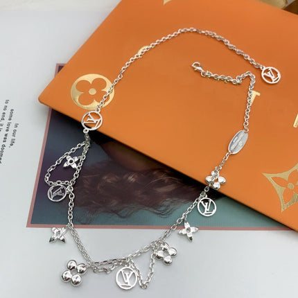 STAR AND SUN MULTI CHARM SILVER NECKLACE