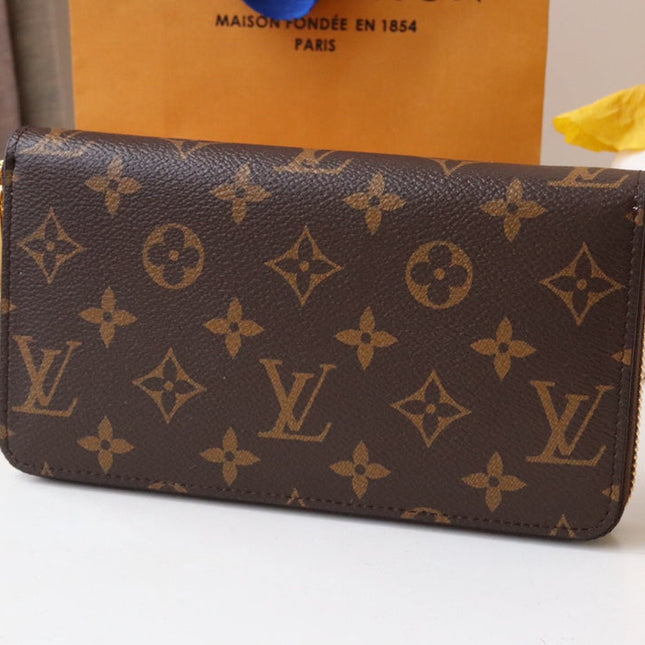 ZIPPY WALLET 9.5 MONOGRAM CANVAS