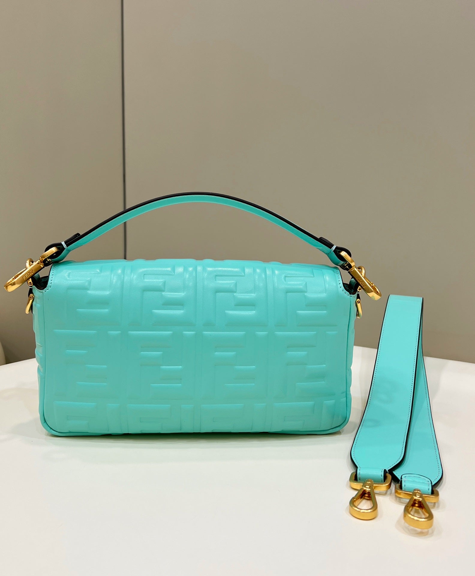 BAGUETTE WITH FF MOTIF 27 IN TURQUOISE SOFT LAMBSKIN GOLD HARDWARE