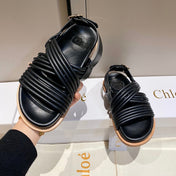 CROSS STRAP SANDAL IN BLACK RUBBER WITH GOLD HARDWARE