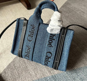 MINI WOODY TOTE BAG 20 IN BLUE DENIM BLACK CALFSKIN