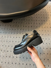 MIUMIU 26S LACED FUME SHOES IN BLACK GLOSSY CALFSKIN