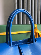 SAIGON SOUPLE BAG 34 IN CURIOUS BLUE GOYARDINE CANVAS AND CALFSKIN