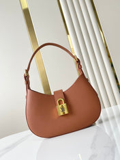 LOW KEY SHOULDER BAG 26 IN COGNAC GRAINED CALFSKIN GOLD BUCKLE