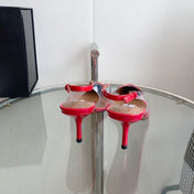 ALAIA HIGH 6 CM SLINGBACK IN CHERRY RED PATENT CALFSKIN AND FILM