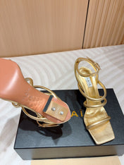 ALAIA THREE-STRAPS HIGH HEEL SANDALS IN GOLDEN PATENT LAMBSKIN