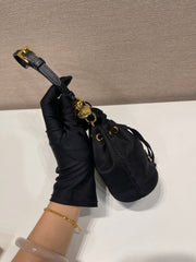 MINI BUCKET BAG 10 IN BLACK RE-NYLON AND SAFFIANO LEATHER STRAP