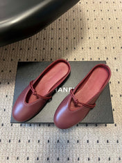 BOTTEGA VENETA 26S FLAT MULES IN DARK RED LAMBSKIN