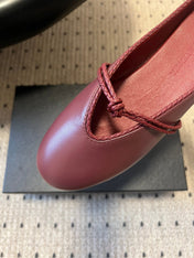 BOTTEGA VENETA 26S FLAT MULES IN DARK RED LAMBSKIN