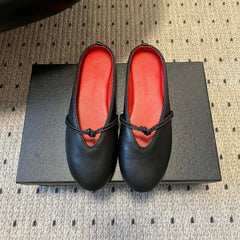 BOTTEGA VENETA 26S FLAT MULES IN BLACK LAMBSKIN