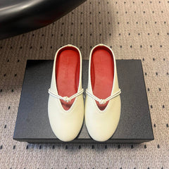BOTTEGA VENETA 26S FLAT MULES IN CREAM WHITE LAMBSKIN