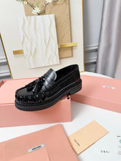 MIUMIU 26S TASSEL LOAFERS IN BLACK CALFSKIN