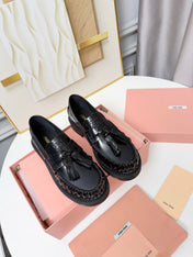 MIUMIU 26S TASSEL LOAFERS IN BLACK CALFSKIN