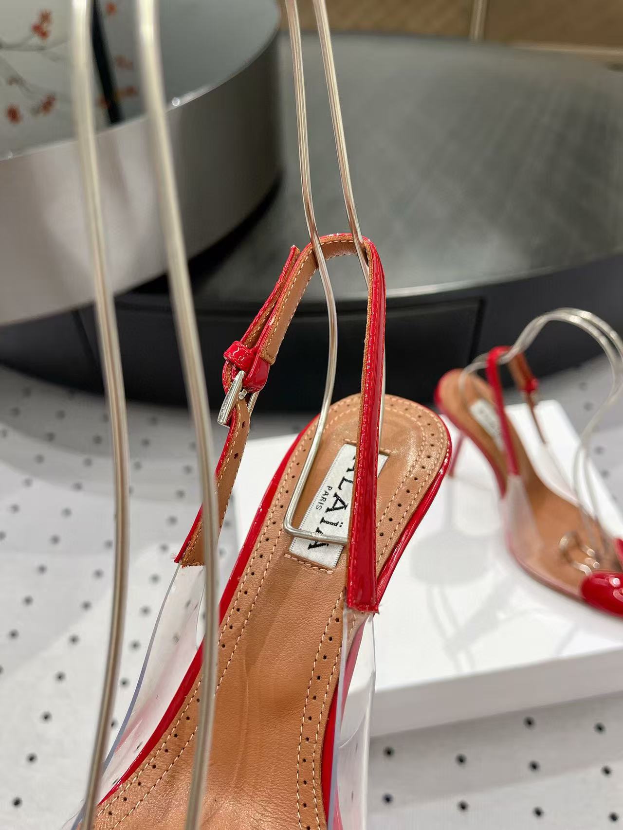 ALAIA HIGH 9 CM SLINGBACK IN CHERRY RED PATENT CALFSKIN AND FILM