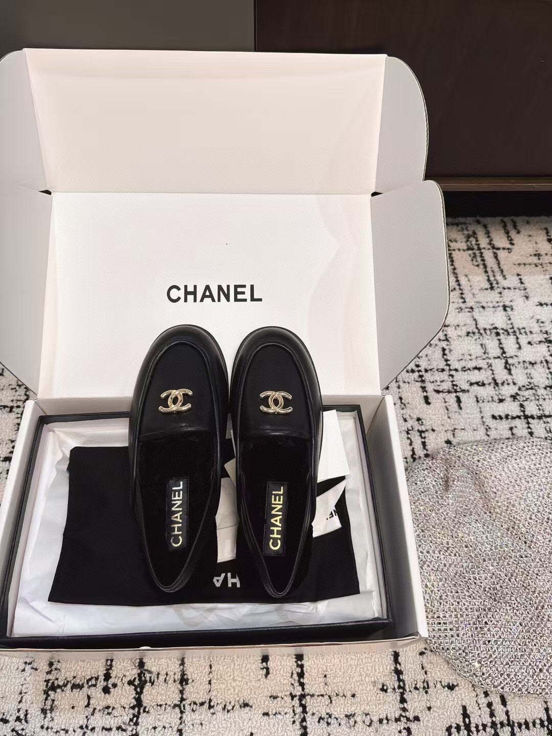 SLINGBACK LOAFER IN BLACK CALFSKIN AND SHEARLING