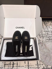 SLINGBACK LOAFER IN BLACK CALFSKIN AND SHEARLING