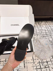 SLINGBACK LOAFER IN BLACK CALFSKIN AND SHEARLING