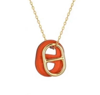 O'MAILLON PENDANT IN SWIFT CALFSKIN WITH GOLD PLATED HARDWARE