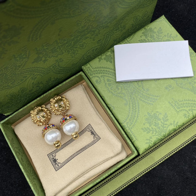 GG LION HEAD PEARL COLORED DIAMOND EARRINGS