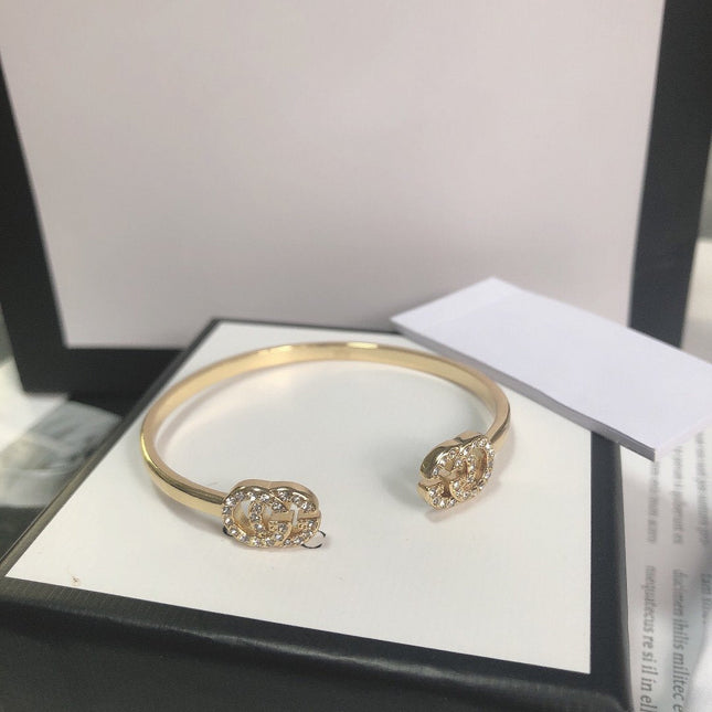 GOLD RUNNING DIAMOND LOGO BANGLE BRACELETS