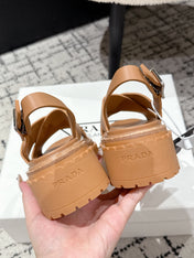 PRADA 25S CRISSCROSS SANDALS IN BURNT ORANGE CALFSKIN LOGO